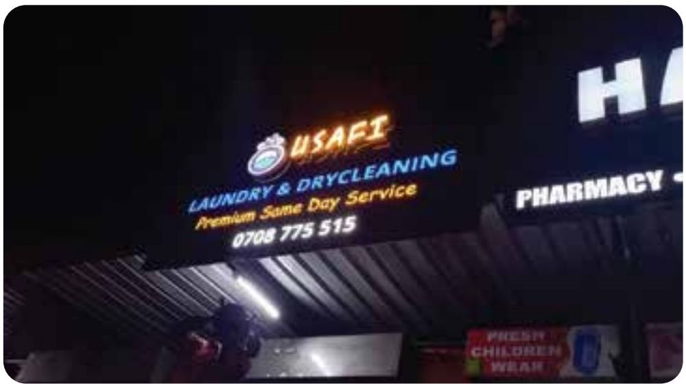 Lit shopfront row for Usafi Laundry & Drycleaning — Illuminated & Neon by Brand It KE in Kenya